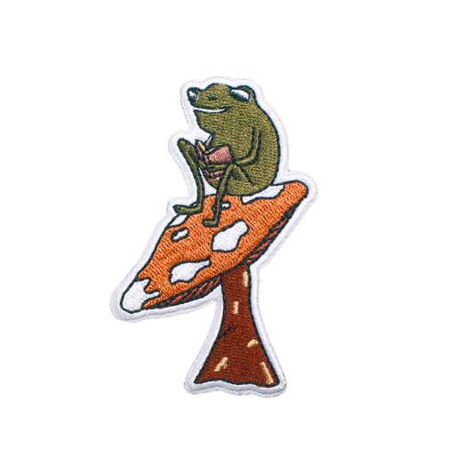 READING ON A MUSHROOM FROG PATCH